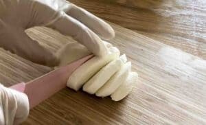 Slicing mozzarella cheese.